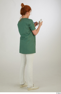 Photos Daya Jones Nurse in green Pose 2 preparing medication…